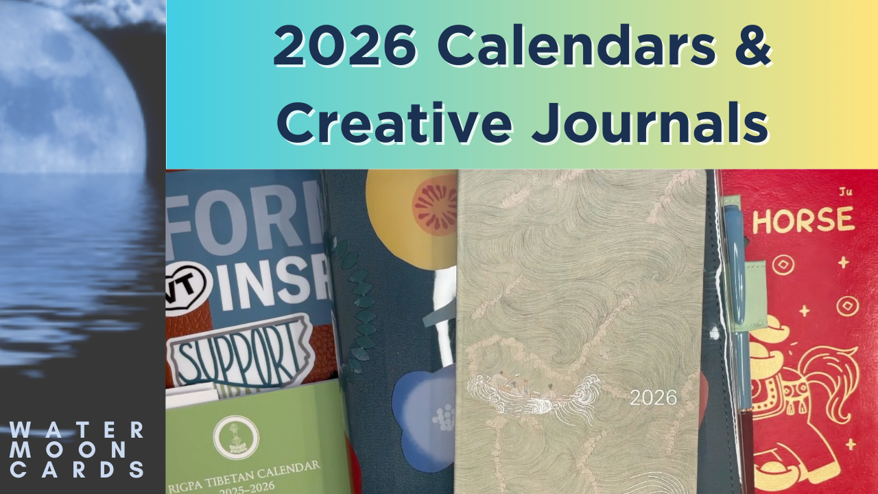 A pile of calendars and journals of different sizes and styles.